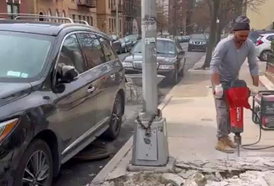 A New York City sidewalk excavation — a source video frame of the kind Argus grounds against OSHA and DOB rules.